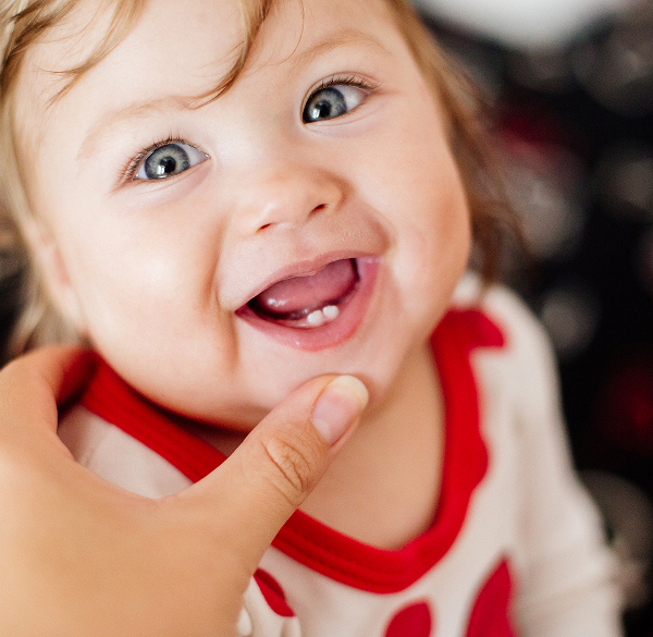Baby with newly erupted teeth